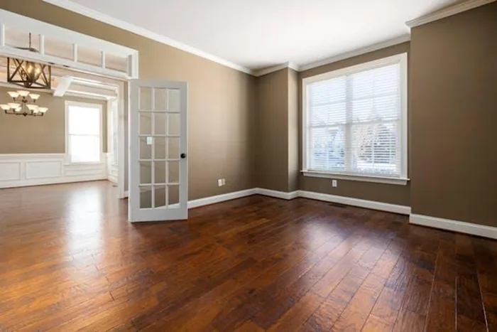 Empty room with two glass doors in a Menifee rental property